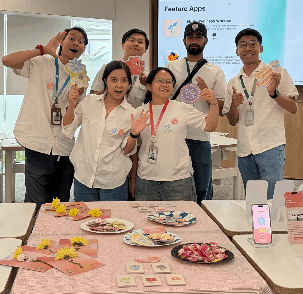 The six-person MoM team behind their table at the Academy showcase